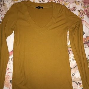 A long sleeve mustard top